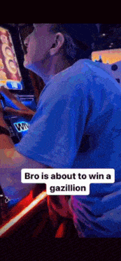 a man in a blue shirt is playing a video game and says bro is about to win a gazillion