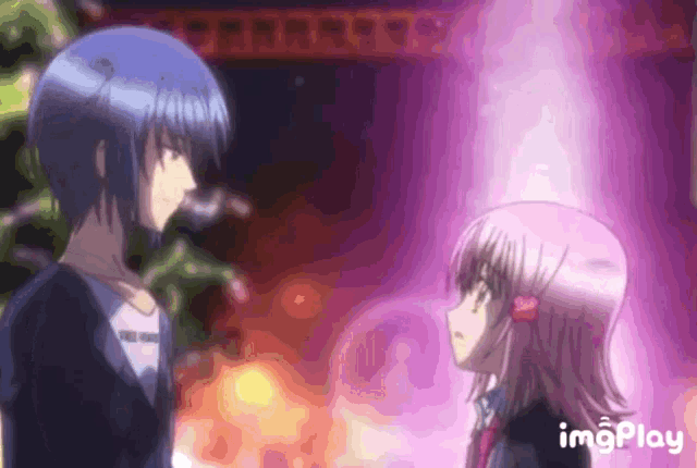 a boy and a girl are standing next to each other with a purple background behind them and the words imgplay on the bottom