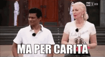 a man and a woman standing next to each other with the words ma per carita