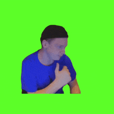 a man in a blue shirt and hat is holding a bag of food in front of a green background .