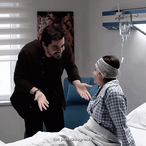 a man standing next to a woman in a hospital bed with the words tw pistachiogrenty on the bottom