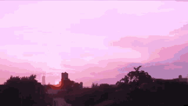a silhouette of a person standing in front of a purple sky .
