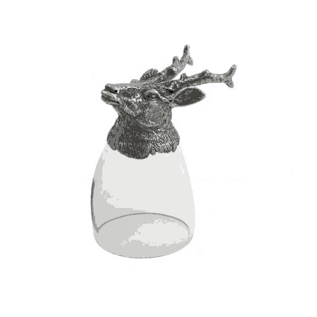 a glass with a goat head on it