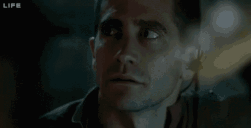 a close up of a man 's face with the word life on the bottom right
