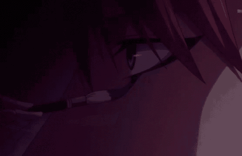 a close up of a person 's face with a dark background