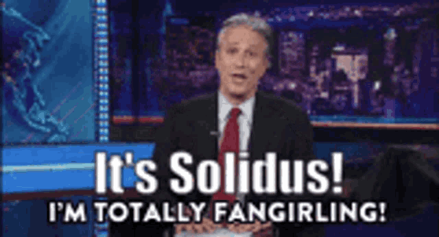 a man in a suit and tie is saying it 's solidus
