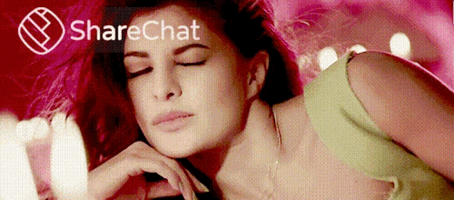 a woman with her eyes closed in front of a sharechat advertisement