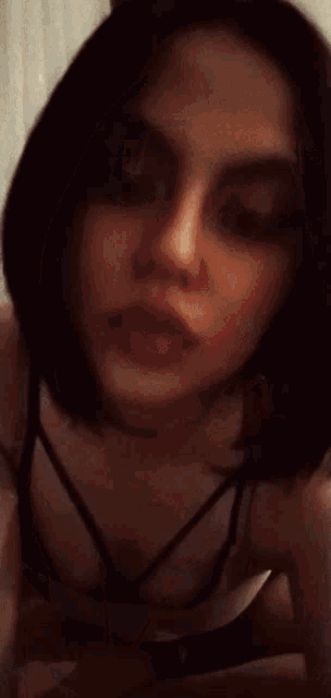 a close up of a woman 's face with red lipstick on