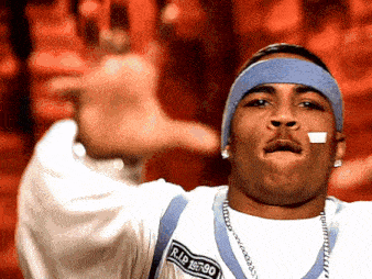a man wearing a headband that says r.i.p. 1980-90