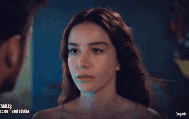 a close up of a woman 's face with sophie written on the bottom right corner