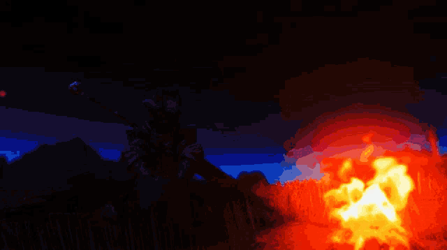 a pixel art of a man sitting by a fire at night