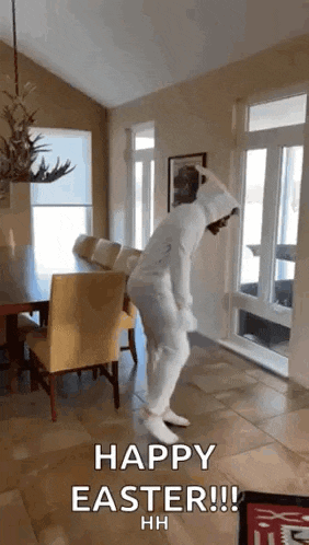 a person in a bunny suit is dancing in a living room .