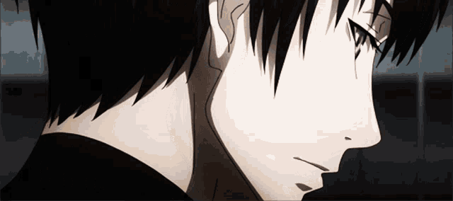 a close up of a person 's face with a black shirt on