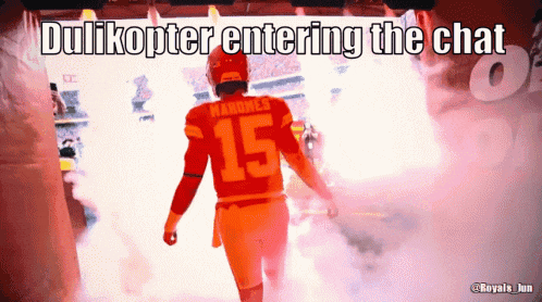 a man wearing a number 15 jersey walks through a tunnel