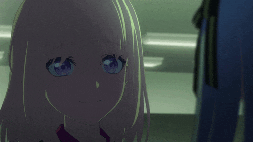 a girl with pink hair and blue eyes looks at the camera