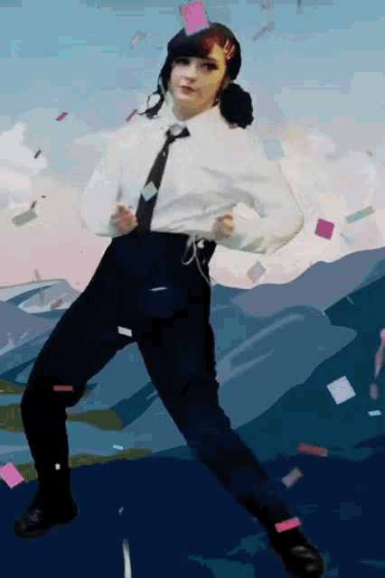 a girl in a white shirt and tie is dancing in front of a mountain
