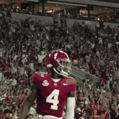 a football player in a red jersey with the number 4 on it