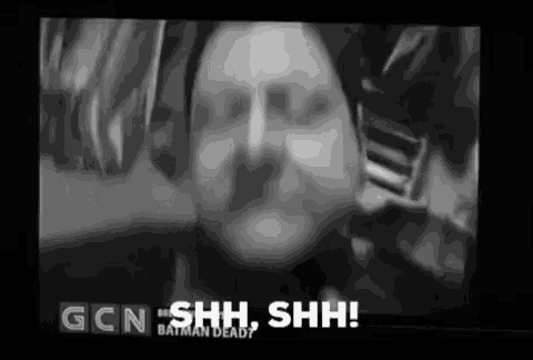 a black and white photo of a man with the words gcn shh shh on the screen