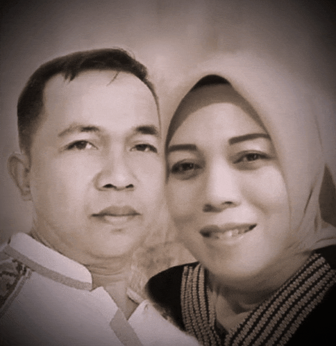 a man and a woman are posing for a picture
