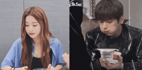 a man and a woman are eating food and the man is wearing a shirt that says " the bomb "
