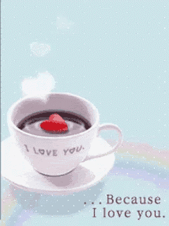 a cup of coffee that says i love you with a strawberry on top
