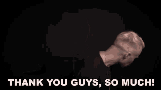 a man is flexing his muscles and saying " thank you guys so much "