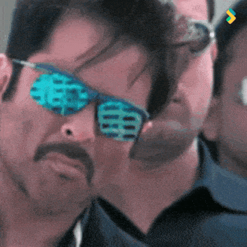 a man wearing sunglasses with a chinese symbol on the lens