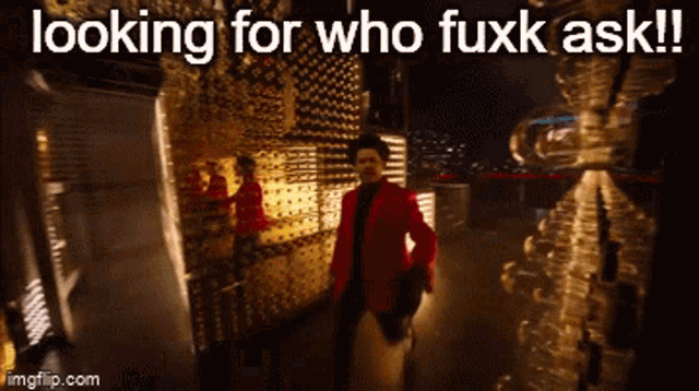 a man in a red jacket is walking in a dark room with the words looking for who fuxk ask below him