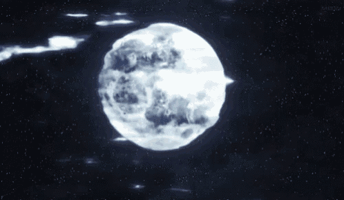 a full moon in the night sky with stars