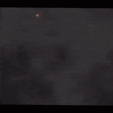 a close up of a fire ring in the night sky .