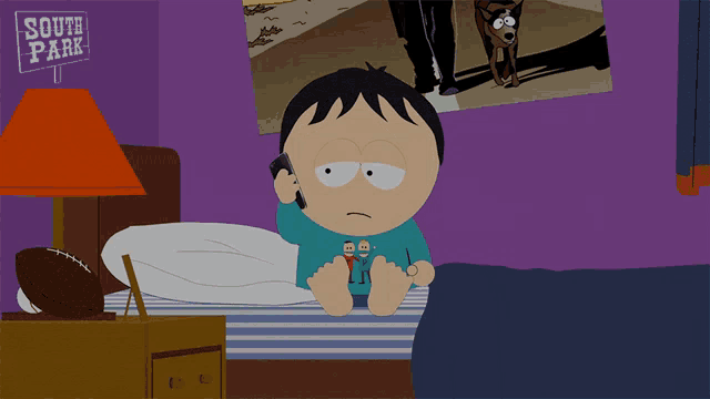 a cartoon of a boy talking on a cell phone in front of a south park sign
