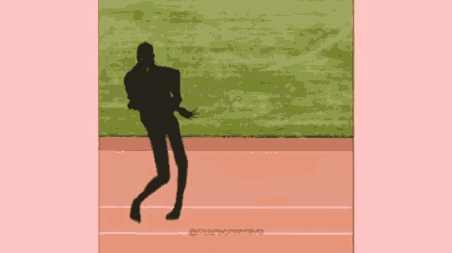 a silhouette of a person standing on a track with a pink background