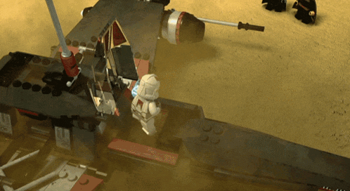 a lego model of a fighter jet is being destroyed by a storm trooper