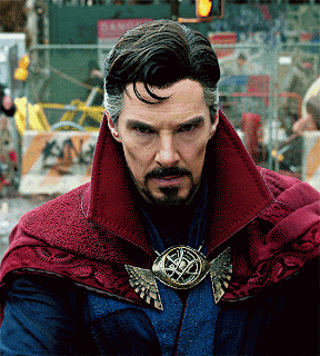 a man with a beard is wearing a red cape and a pendant