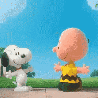 charlie brown and snoopy are hugging each other on the sidewalk .