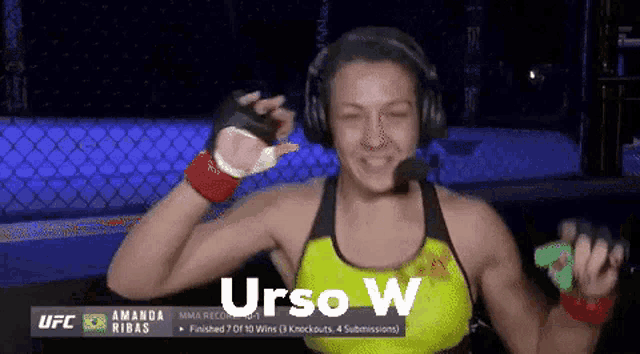 a woman wearing headphones and a yellow top with the word urso w on the bottom