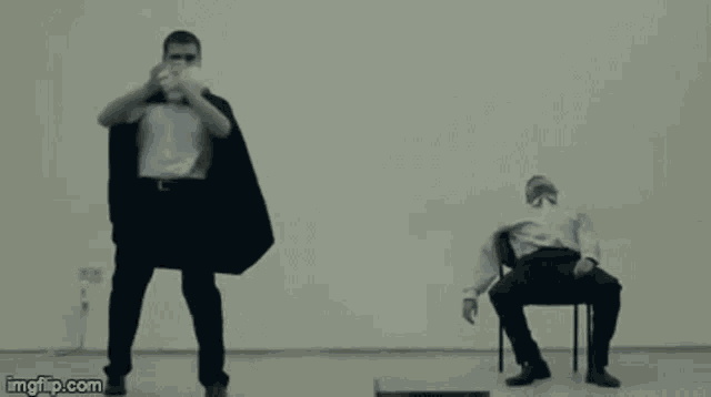 two men are dancing in front of a white wall and the words imgflip.com are on the bottom