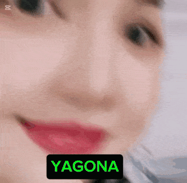 a close up of a woman 's face with the name yagona written in green