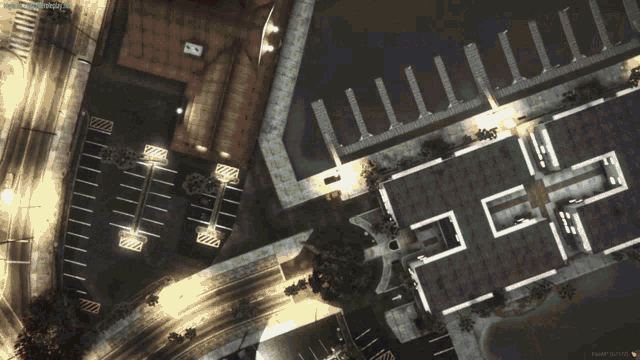 an aerial view of a parking lot and a building with the letters h and i on the top of it