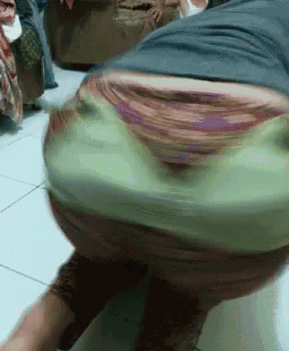 a blurry photo of a person 's butt with a frog face on it