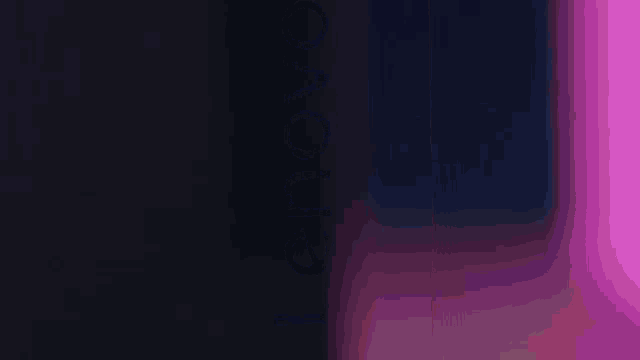 a purple light is coming out of a dark room