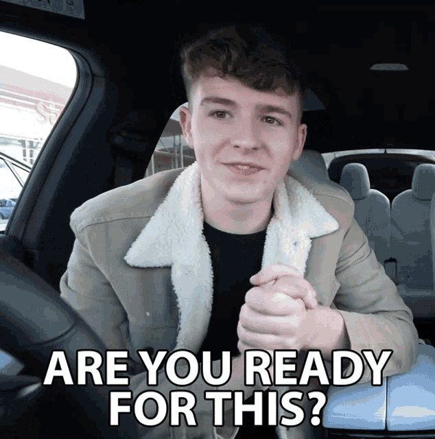 a man sitting in a car with the words are you ready for this