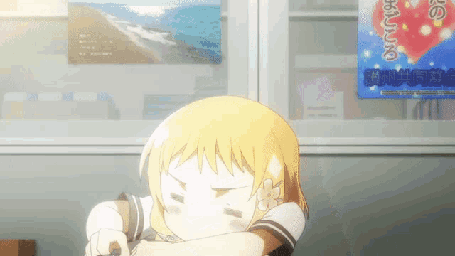 a girl is sitting in front of a poster that says ' ' ' ' ' ' on it