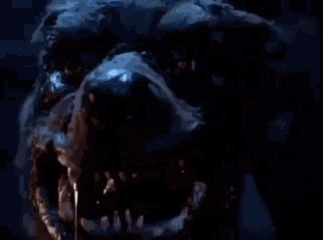 a close up of a monster 's face with a lot of teeth