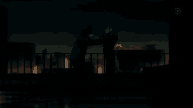 a couple standing on a balcony at night with a purple sign in the background that says ' pioneer '