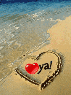 a heart drawn in the sand with the word ya written on it