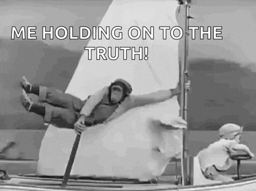 a man is flying through the air on a sailboat with the words `` me holding on to the truth '' written on it .