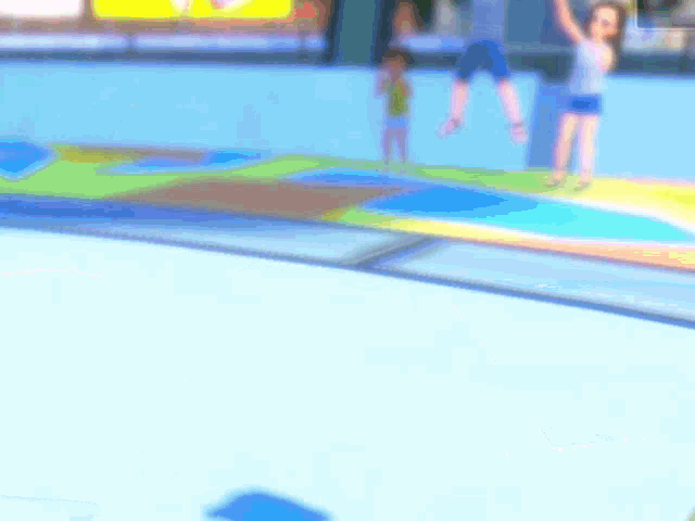 a blurry picture of a trampoline with people jumping on it