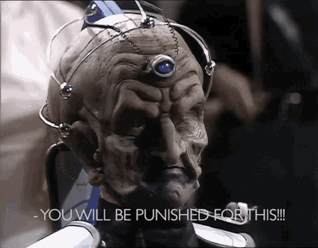 a close up of a robot head with the words you will be punished for this