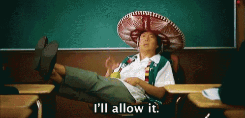 a man wearing a sombrero is sitting in a classroom with his legs crossed and says `` i 'll allow it ''